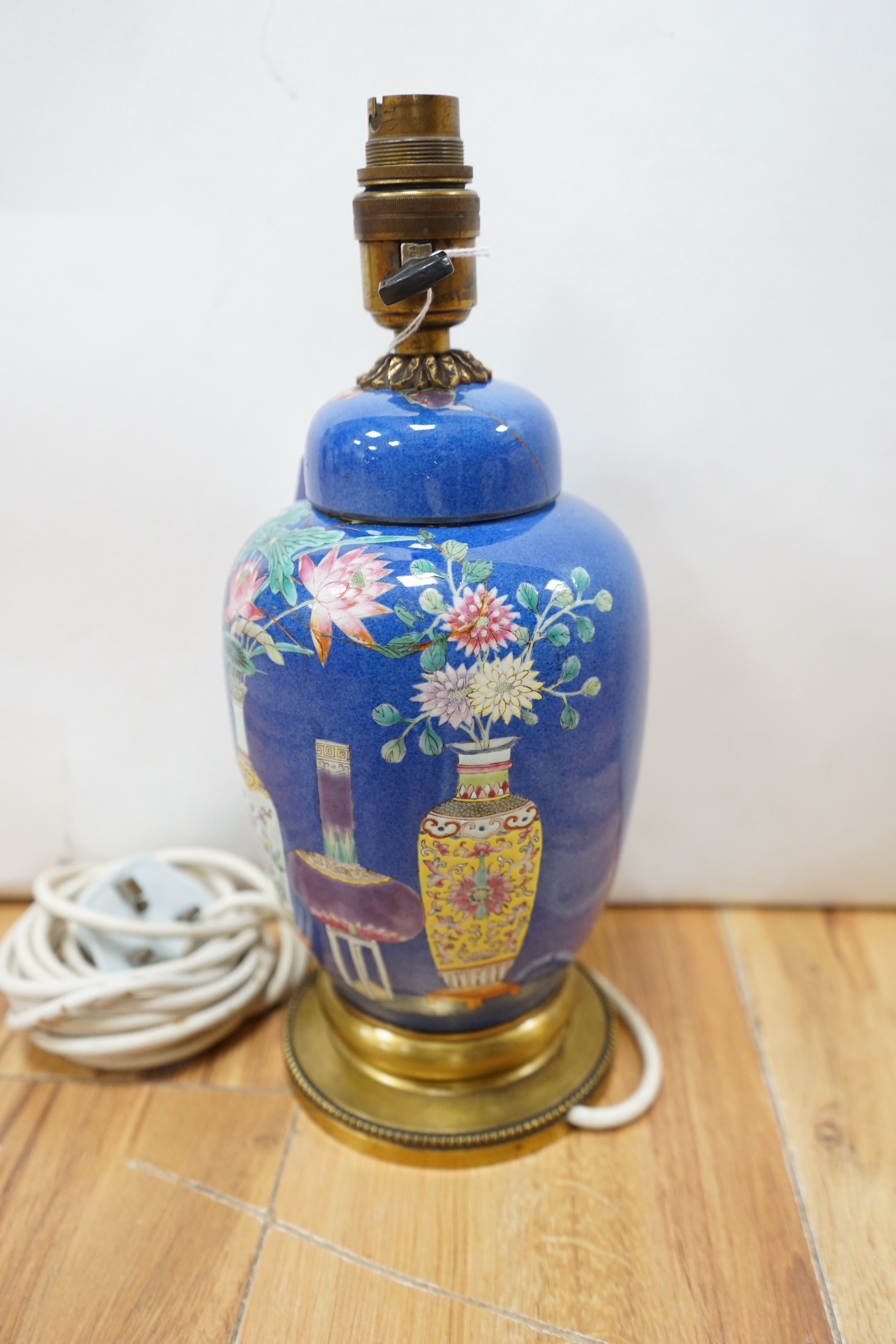 A late 19th century Chinese jar and cover with blue background and fine enamelled vases, jars, etc., later converted into a table lamp (cover broken in half and late glued to jar)